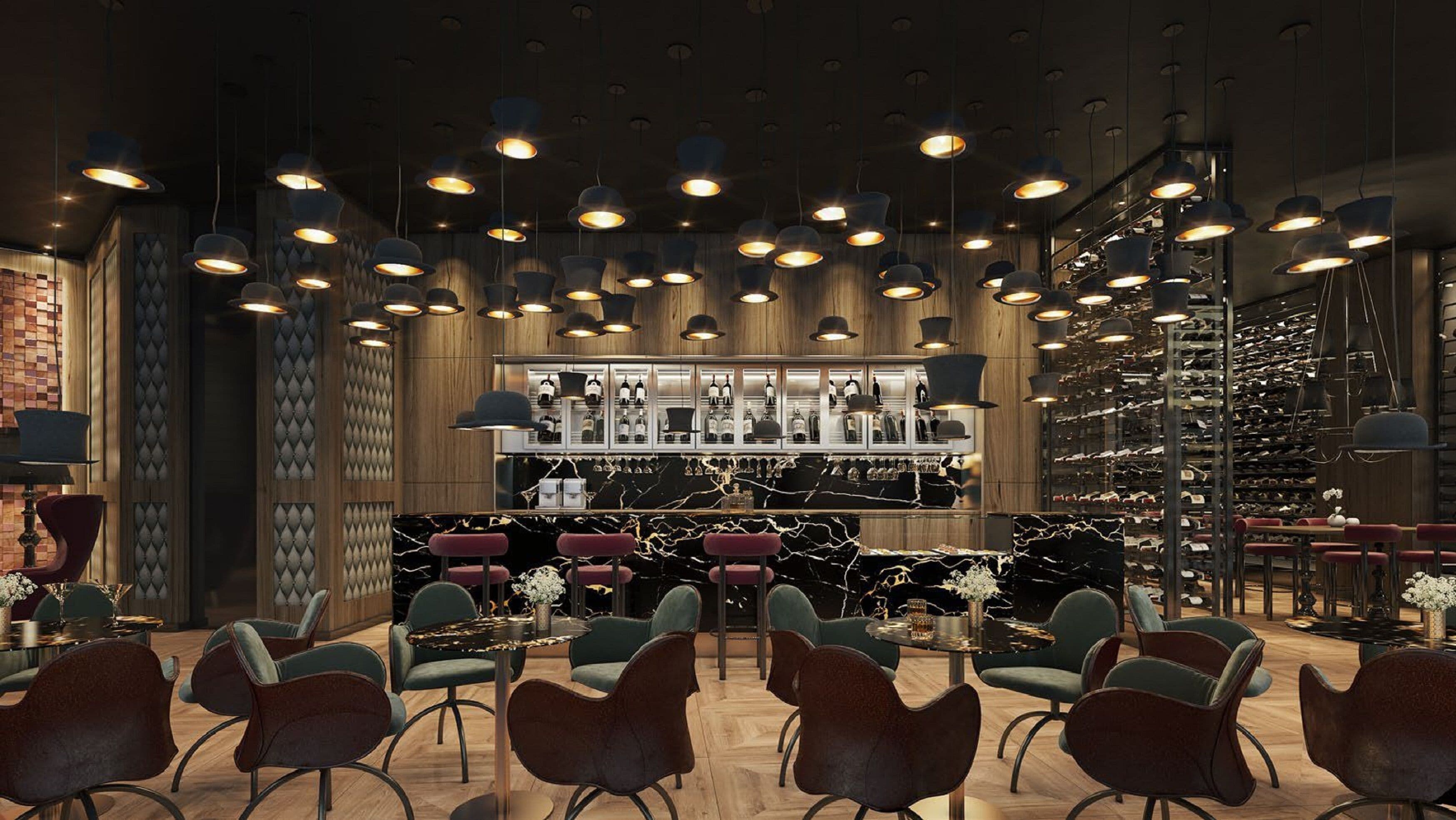 A modern bar area with multiple hanging pendant lights, a wine rack, and seating with round tables and chairs.