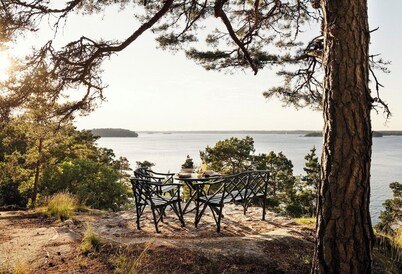 A restored 1911 waterfront estate on Skarpö — 7 bedrooms, private dock, and wood-fired sauna