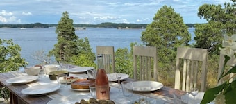 A restored 1911 waterfront estate on Skarpö — 7 bedrooms, private dock, and wood-fired sauna
