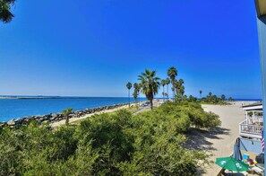 On the beach, sun loungers, beach towels
