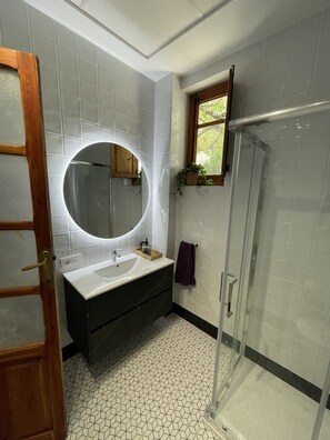 Shower, hair dryer, towels, soap