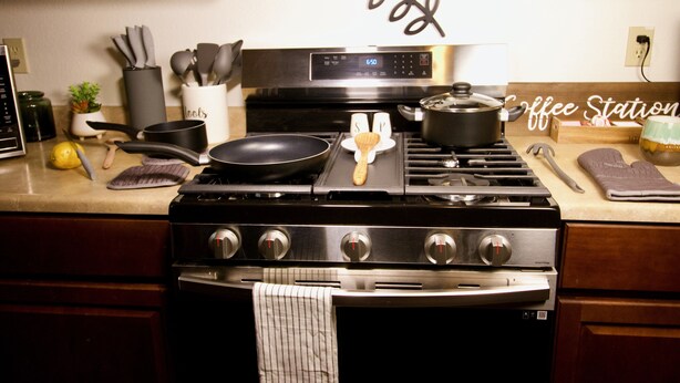 A kitchen with a stove, pots, pans, and a coffee station sign. - 3 blks to Historic downtown Courthouse & Whiskey Row. King bed. Dog Friendly (Prescott)