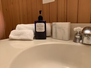 Combined shower/tub, hair dryer, towels, soap