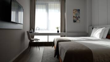 Classic Twin Room | Minibar, in-room safe, soundproofing, iron/ironing board