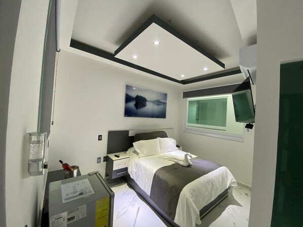 Habitación Deluxe | Minibar, cortinas blackout, insonorización y ropa de cama 