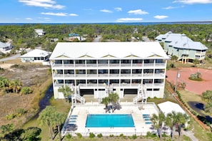 Guests can enjoy scenic views from the hotel's balconies overlooking a body of water.