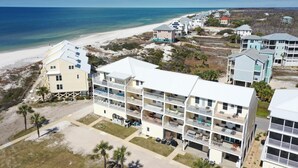 A beachfront hotel with multiple-story buildings, balconies, and a beach view. - Sea Cliff C-16 Gone Fishin' (Port St. Joe)