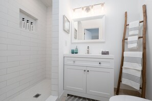 Combined shower/tub, hair dryer, towels, soap
