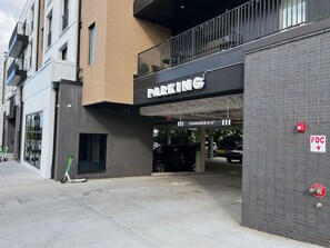 A parking entrance with a sign indicating a clearance of 8'-2".