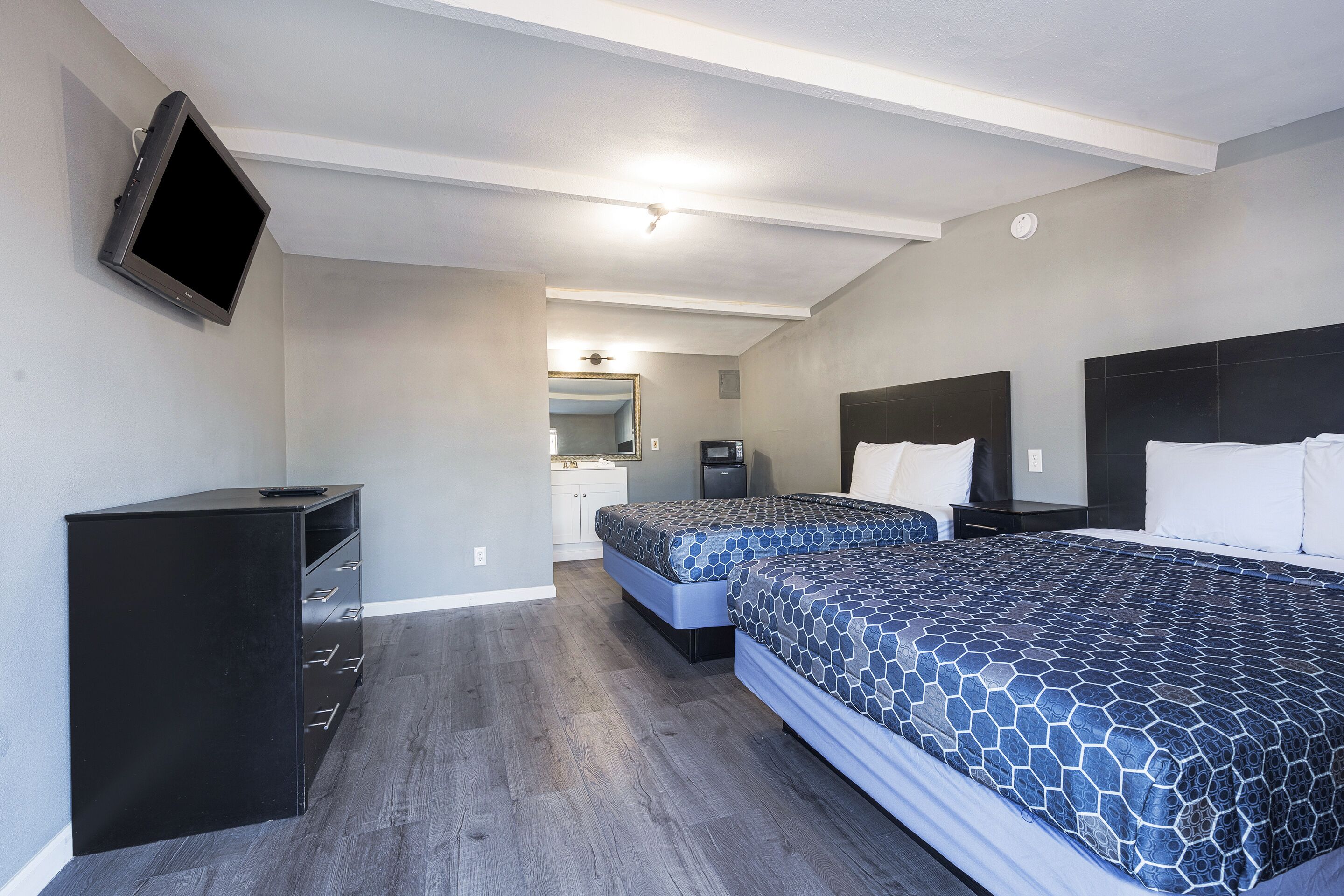 Room, 2 Queen Beds | In-room safe, iron/ironing board, free WiFi, bed sheets