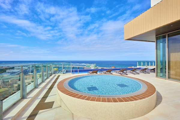 Seasonal outdoor pool, pool umbrellas, pool loungers