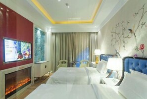 A hotel room with a bed, a TV, a fireplace, and a window with curtains. - International Milan (Deqing)