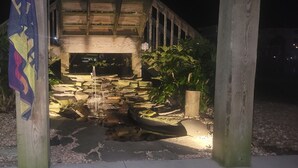 A stone-built structure with a stone staircase leading to a wooden deck. - Belle Brísa-Canal front Surf City, NC (Surf City)