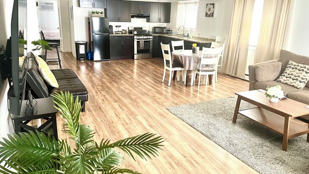 A modern apartment with a living room, dining area, and kitchen. - Homey, Cheerful & Spacious🙂 (Clifton)