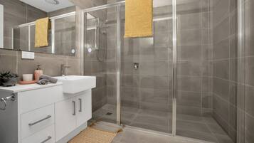 Shower, hair dryer, towels, soap