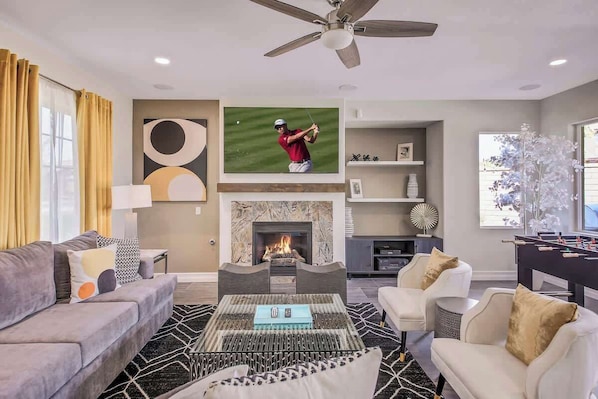 Smart TV, fireplace, table football, books