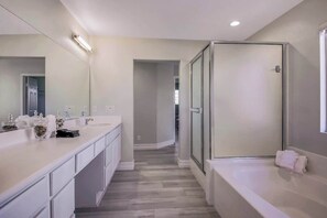 Combined shower/bathtub, hair dryer, towels, soap