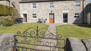 A stone building with a central entrance, a small porch, and a gate labeled "The Priory". - The Priory (Bakewell)