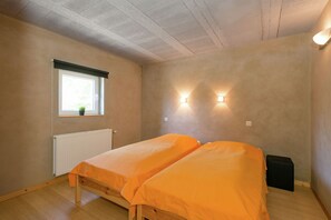 A small, single-room apartment with two beds, a window with a view, and a radiator. - Comfy home near the forest with sauna (Waimes)