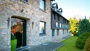 A stone building with a shop entrance labeled "DOGE DU LAC." - Swanky Holiday Home in Waimes with Indoor Swimming Pool (Waimes)