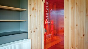 A wooden interior with a glass door labeled "Chaleur". - Swanky Holiday Home in Waimes with Indoor Swimming Pool (Waimes)