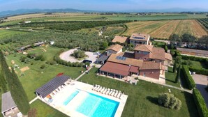 An aerial view of a property with a swimming pool, multiple buildings, and surrounding fields. - Tuscan Stay w/ Jacuzzi (Braccagni)