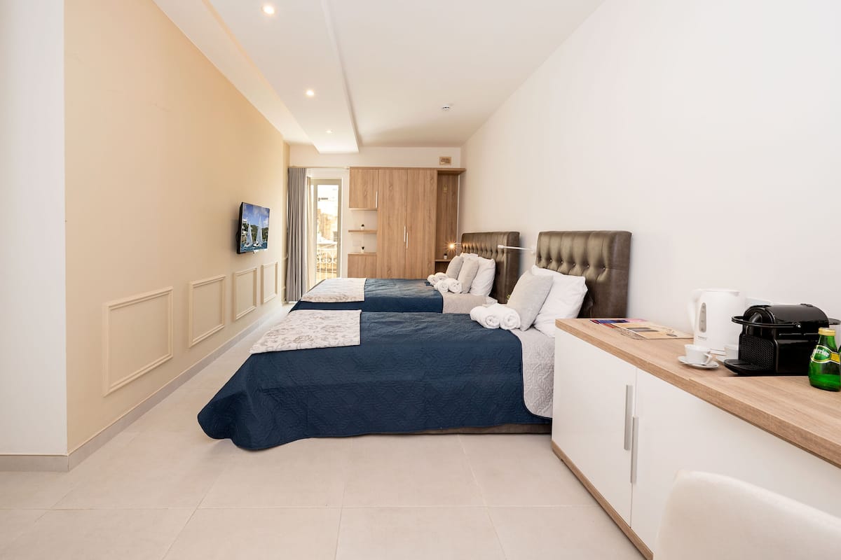 Triple Room | Minibar, desk, laptop workspace, free WiFi