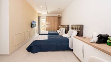 Triple Room | Minibar, desk, laptop workspace, free WiFi