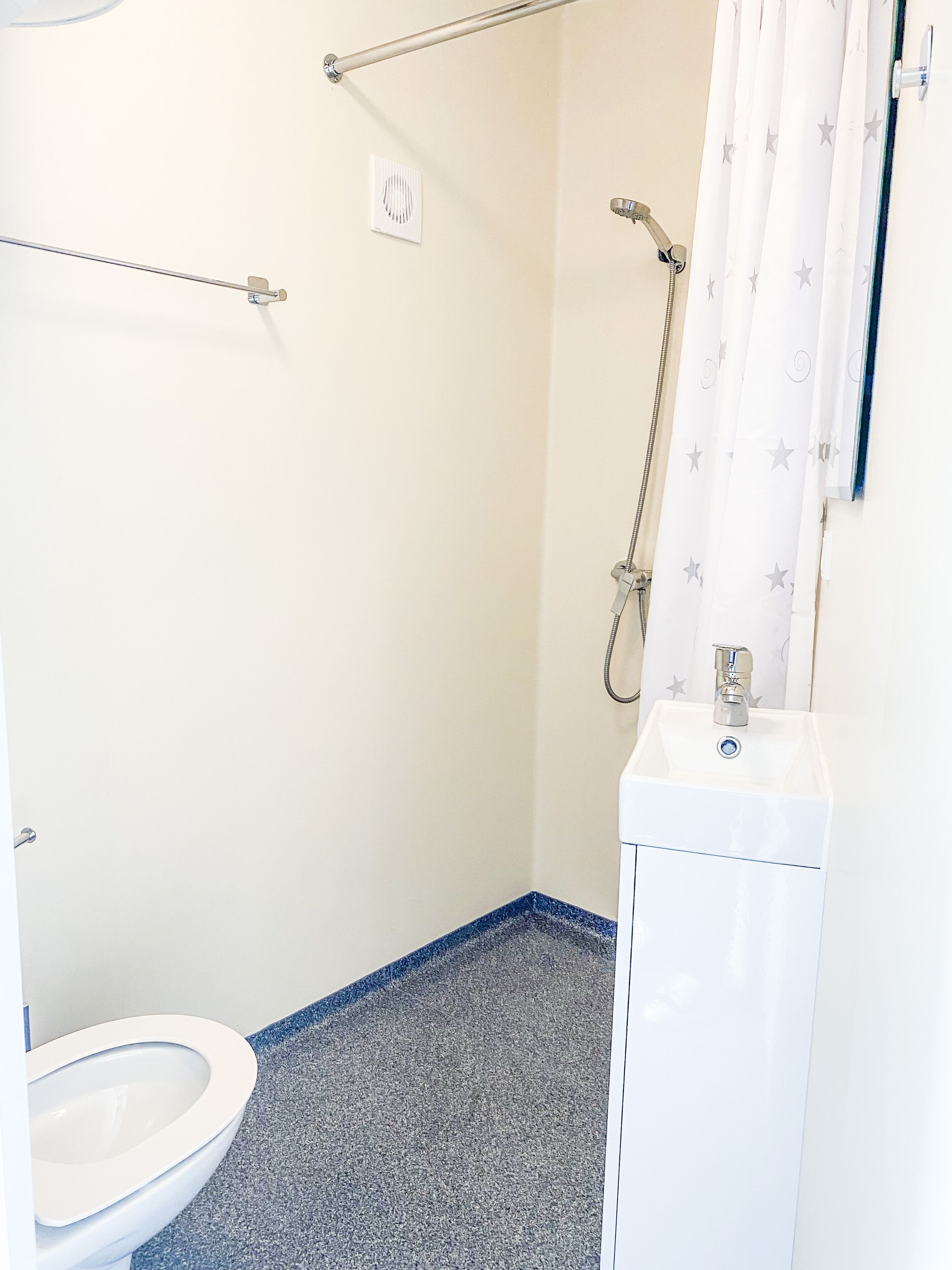 Shower, towels, soap, toilet paper