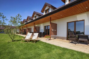 Outdoor dining - Duplex apartments 300 m from the sea. Living room, 2 bedrooms, own terrace. (Darlówko)