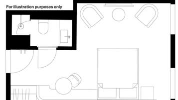A floor plan with a large central room, a smaller room with a door, and a bathroom.