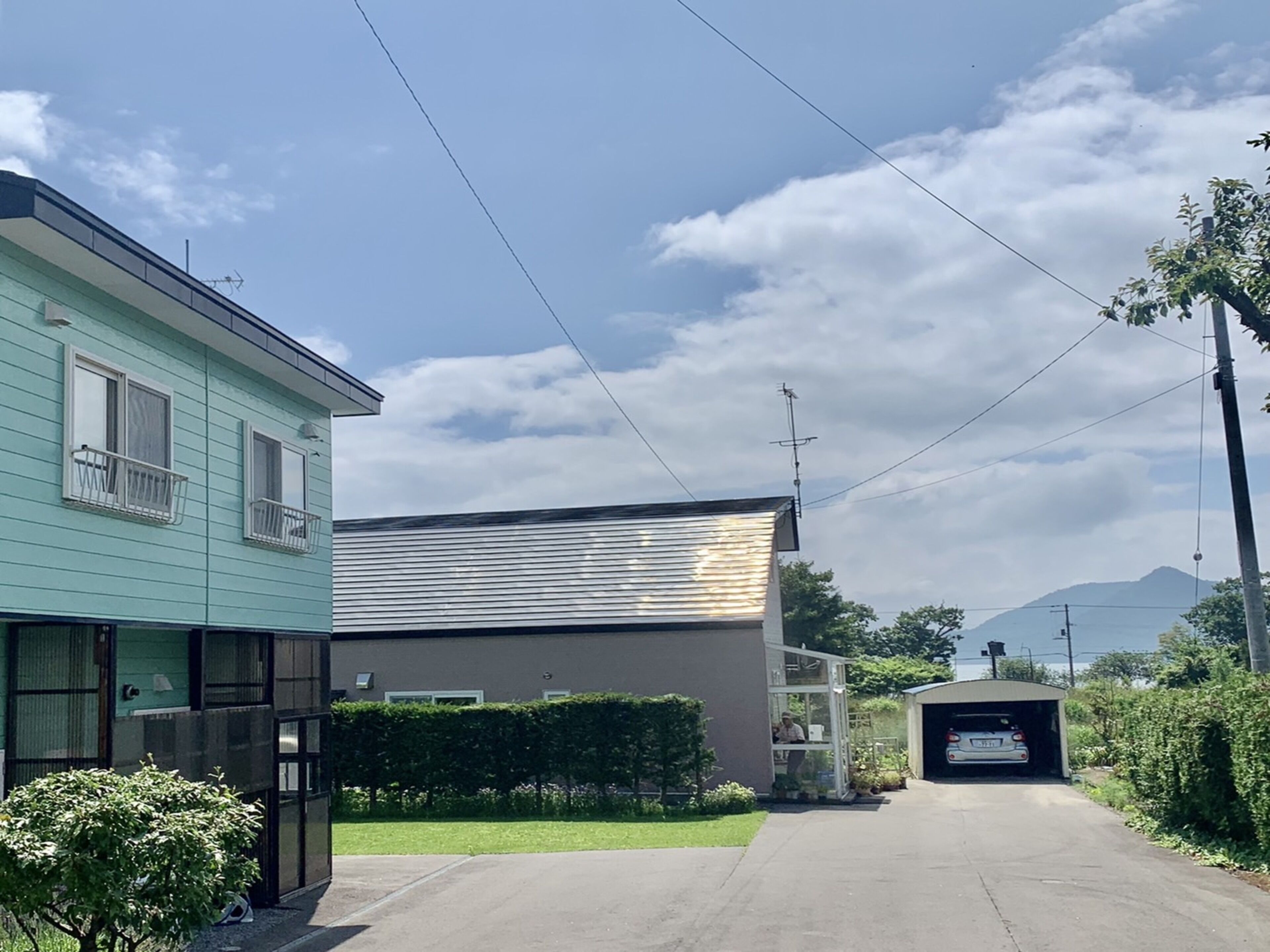 A building with a flat roof and a garage entrance.