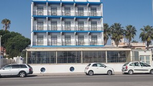 A multi-story hotel named "HOTEL ALOHA" with balconies and large windows. - Hotel Aloha (Burriana)