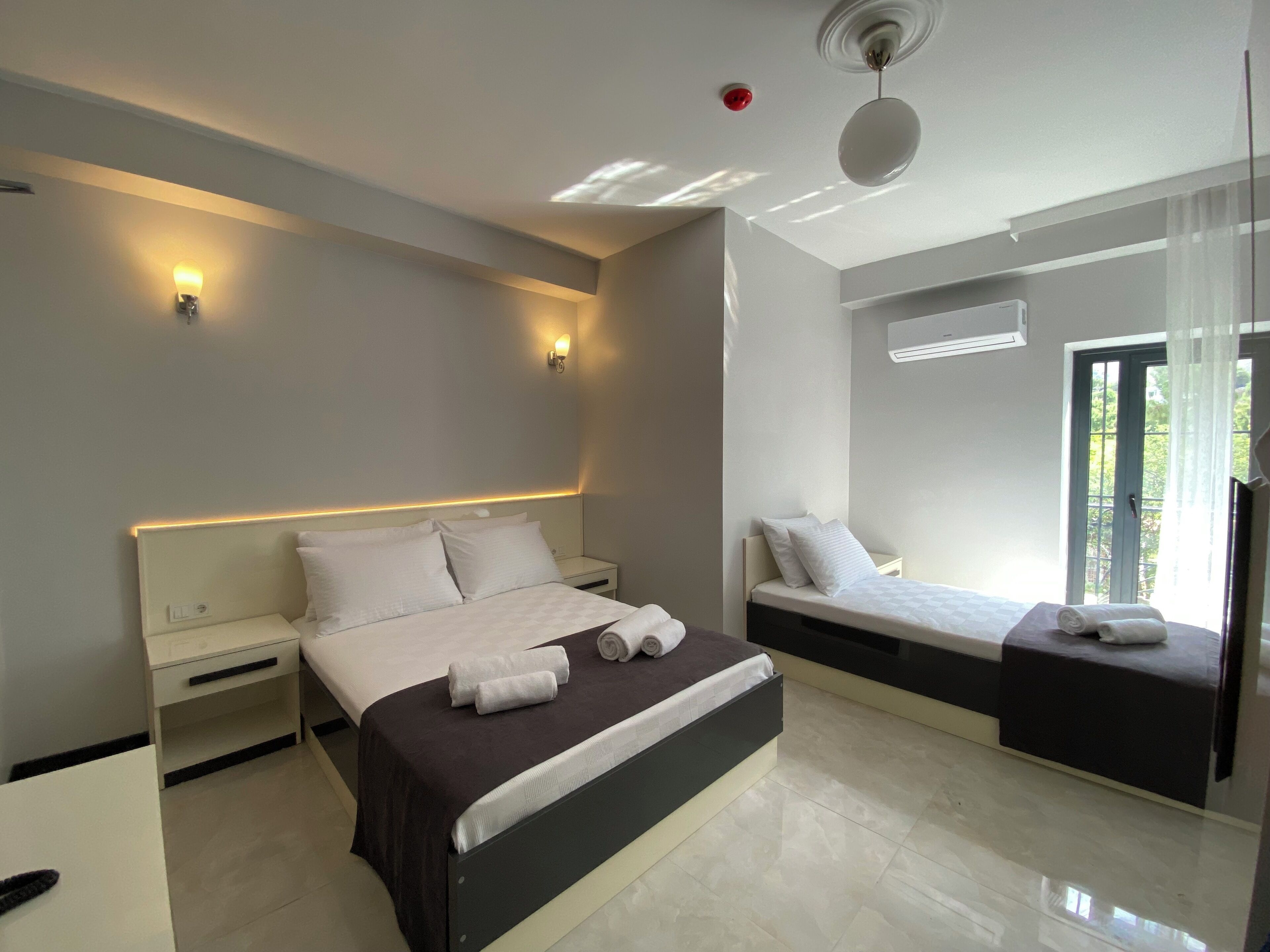 Standard Room, Multiple Beds | Minibar, laptop workspace, iron/ironing board, free WiFi