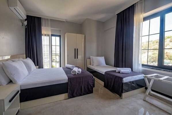 غرفة سوبيريور - عدة أسرّة | ميني بار ومساحة عمل للكمبيوتر المحمول ومكواة/لوح كي وواي فاي مجانًا