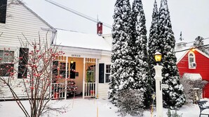 A snow-covered landscape with a white building labeled "OFFICE" and a red building in the background. - 5 Suite in 1820`s house Open Hearth Inn (Trenton)