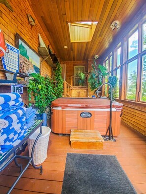 A wooden interior with a hot tub, a staircase, and a view of the outdoors. - 5 Suite in 1820`s house Open Hearth Inn (Trenton)