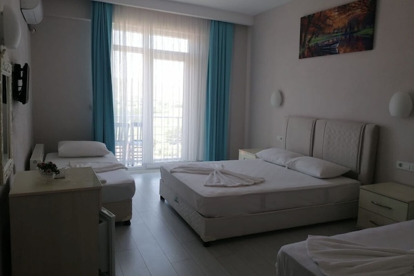 Family Triple Room, Sea View | Bed sheets