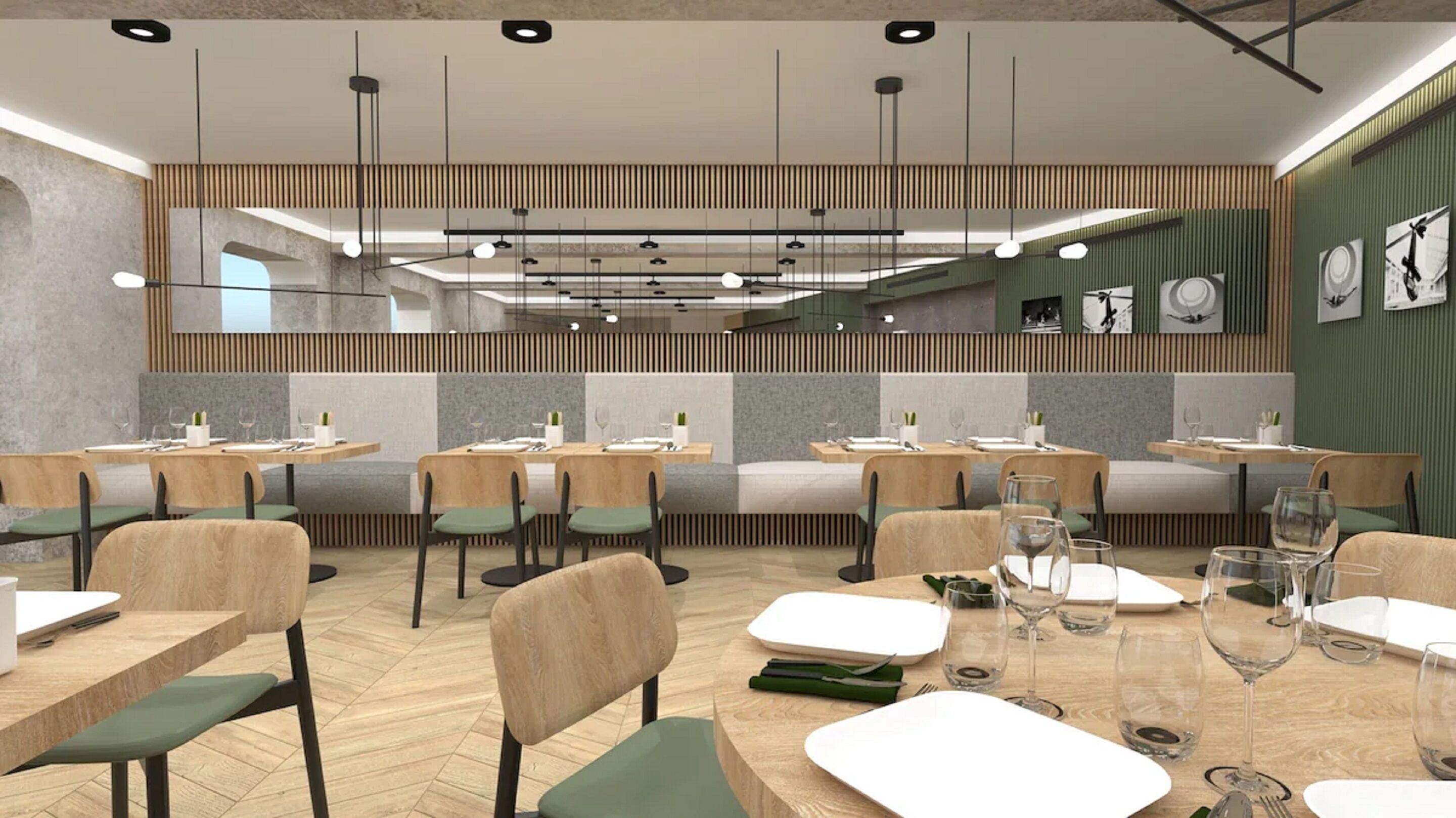 Un interior de restaurante moderno con mesas de madera, sillas con cojines verdes y un techo alto con lámparas colgantes.