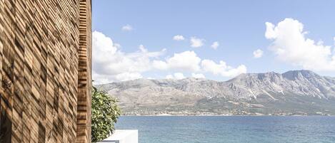 Special Offer - Seafront Suite | Living area | 50-inch Smart TV with digital channels, TV