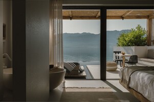 Seafront Suite with Private Heated Pool | Premium bedding, minibar, in-room safe, individually decorated