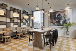 A modern dining area with a checkered floor, wooden tables, and chairs, a large window with a view, and a wall-mounted plant shelf. - Spark by Hilton Vienna Donaustadt (Vienna)