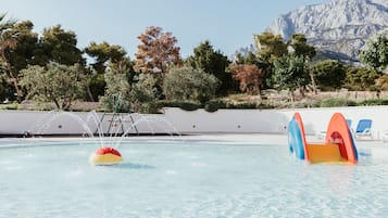 Seasonal outdoor pool, open 8:00 AM to 8:00 PM, pool umbrellas