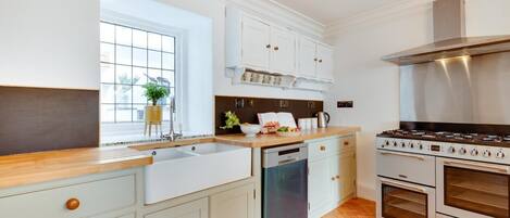 Oven, dishwasher, high chair, cookware/dishes/utensils