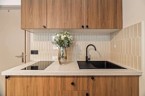 Fridge, microwave, stovetop, coffee/tea maker