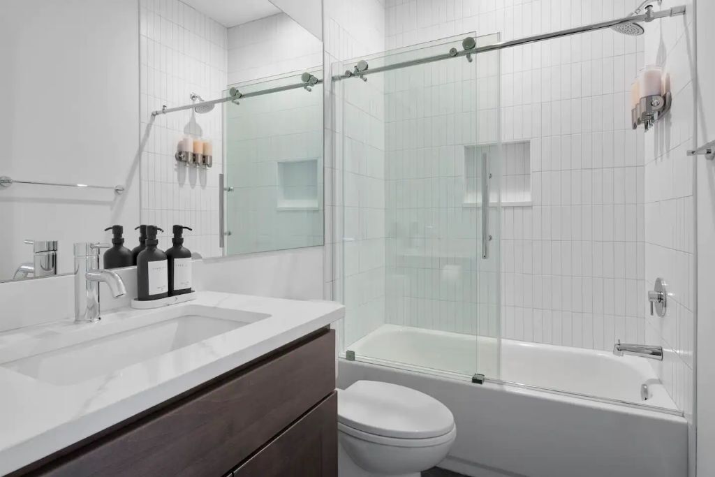 Combined shower/tub, hair dryer, towels, soap
