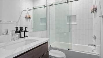 Combined shower/tub, hair dryer, towels, soap