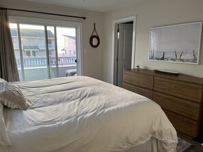 Relax in comfort with a large bed and a dresser, plus a balcony with a view.
