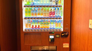 A vending machine with various drinks and snacks, including Kirin beverages and other brands. - APA Hotel Ueno Ekiminami (Tokyo)