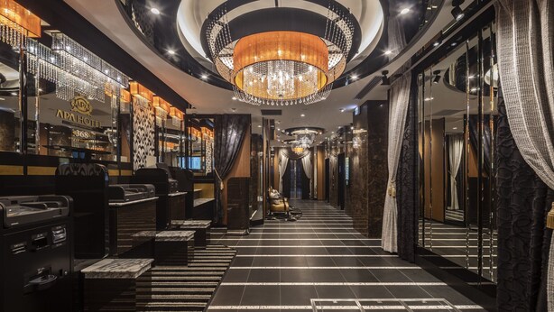 A luxurious hotel lobby with a grand chandelier, a reception desk, and a check-in counter. - APA Hotel Ueno Ekiminami (Tokyo)